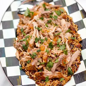 A photo of slow cooker recipes with a plate of pulled pork