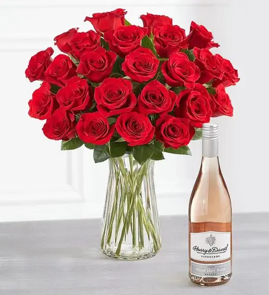 A photo of wine gifts for mom with a bouquet of roses next to a bottle of rose wine