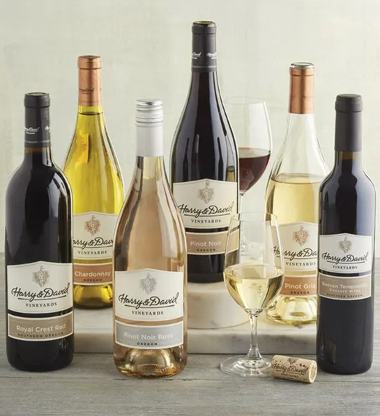 A photo of wine gifts for mom with six bottles of wine on a table