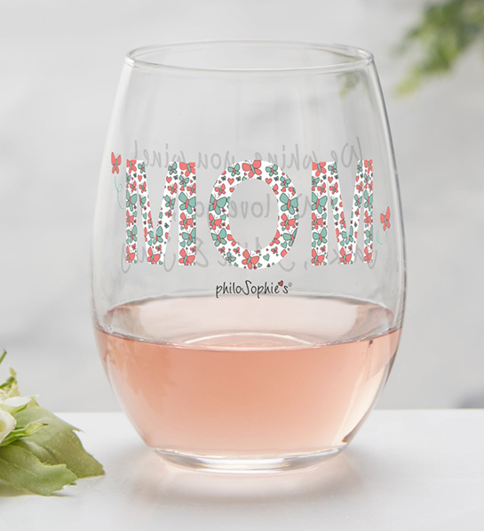 A photo of wine gifts for mom with a personalized stemless wine glass full of rose