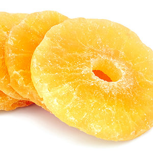 A photo of dried fruit with several candied pineapple rings