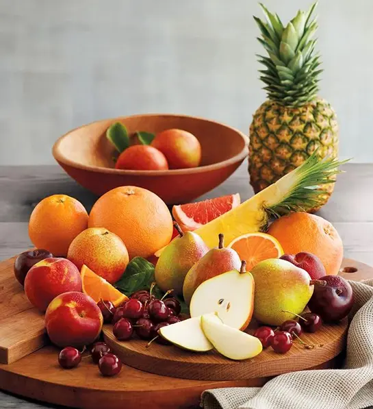 A photo of graduation gift ideas with an array of fresh fruit on a table