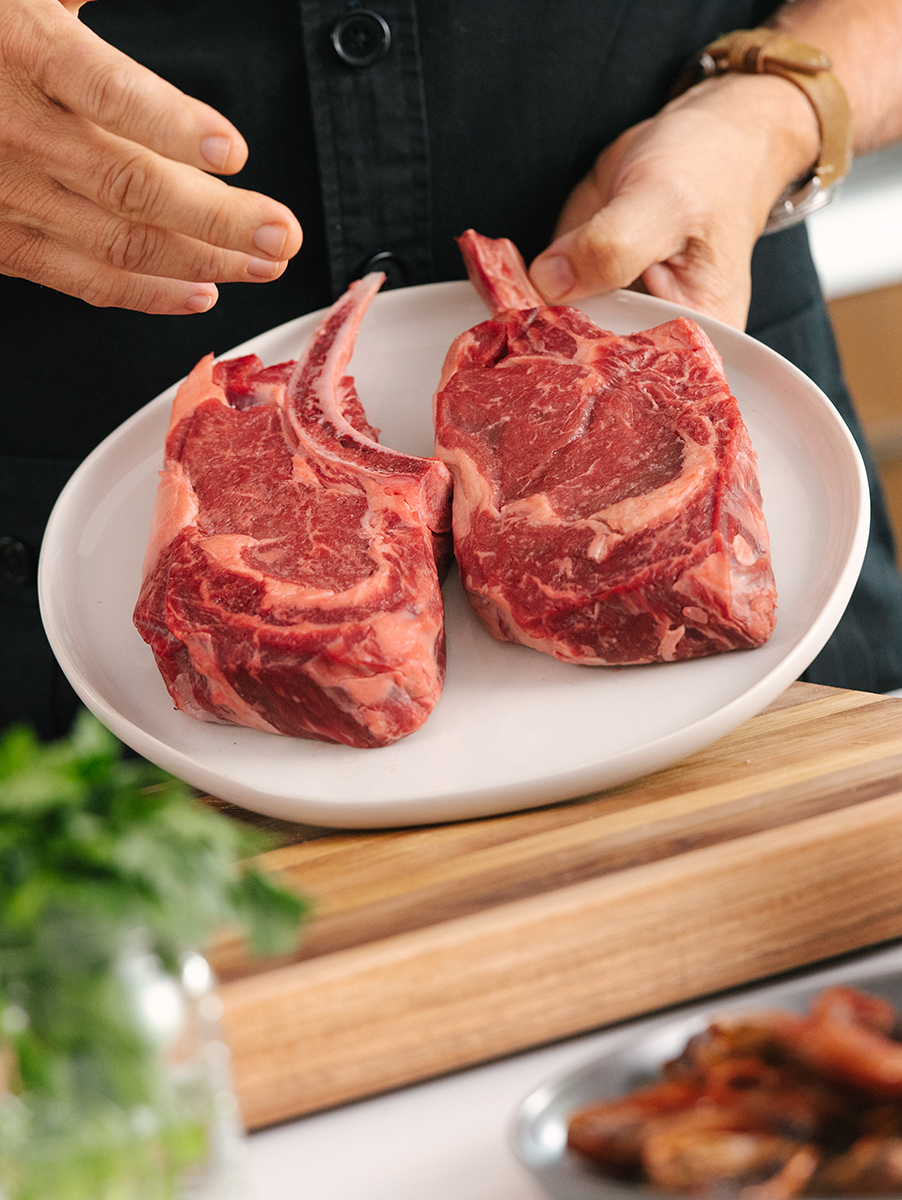 This is an image of indoor grilling of a ribeye steak with Geoffrey Zakarian.