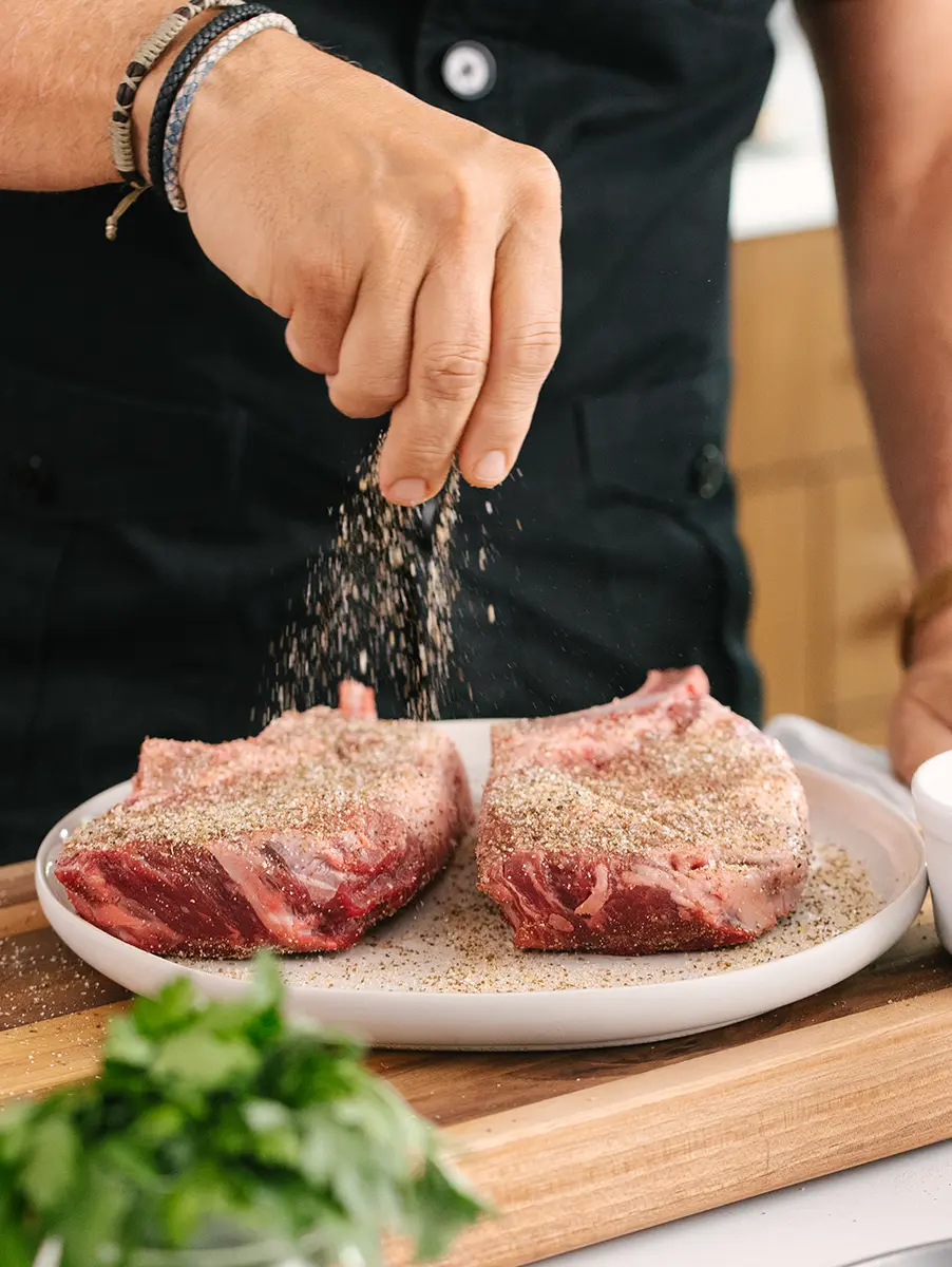 This is an image of indoor grilling of a ribeye steak with Geoffrey Zakarian.