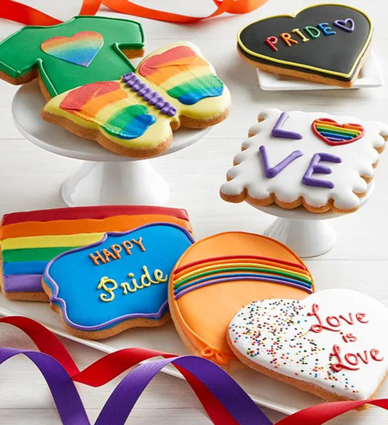 A photo of pride month gifts with iced cookies decorated with rainbows and hearts