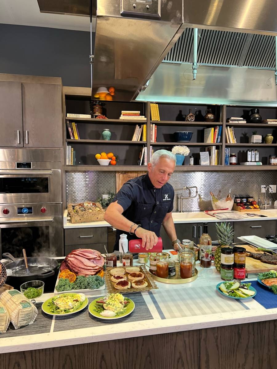 Photo of summer entertaining recipes with Geoffrey Zakarian making bloody marys in a ktichen.