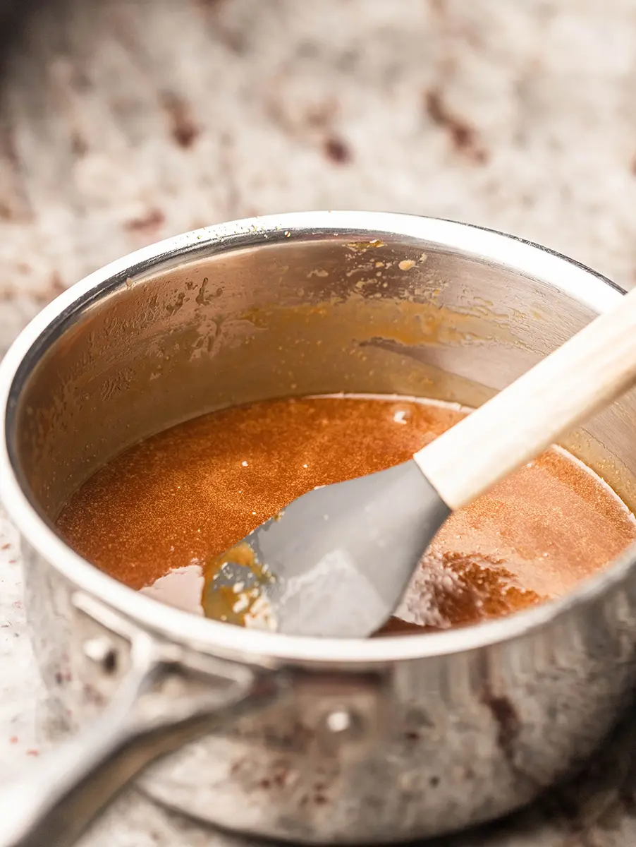 Photo of caramel ice cream with homemade caramel sauce in a bowl