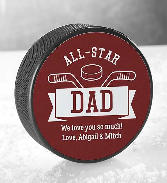 A photo of father's day gift guide with a personalized hockey puck