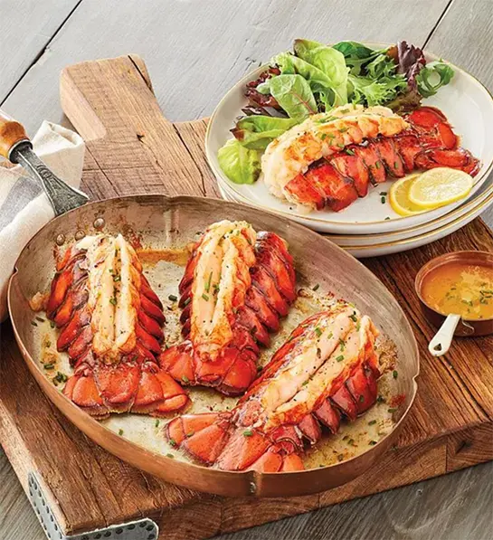 Photo of grilling gifts with a plate of cooked lobster tails.