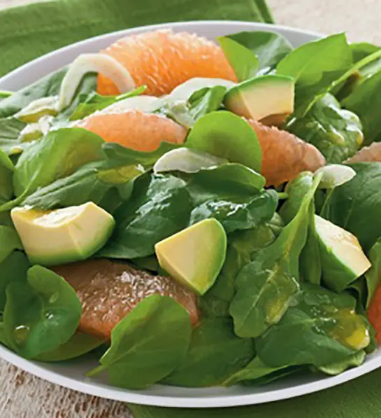 Photo of how to ripen an avocado with a closeup of an avocado and grapefruit salad.