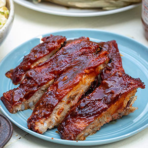 Photo of july recipes with a platter of grilled ribs.
