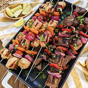 Photo of july recipes with a tray of steak kebabs.