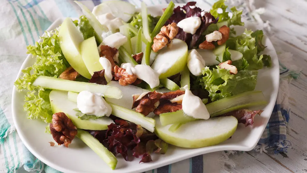 Photo of salads with a closeup of a Waldorf salad