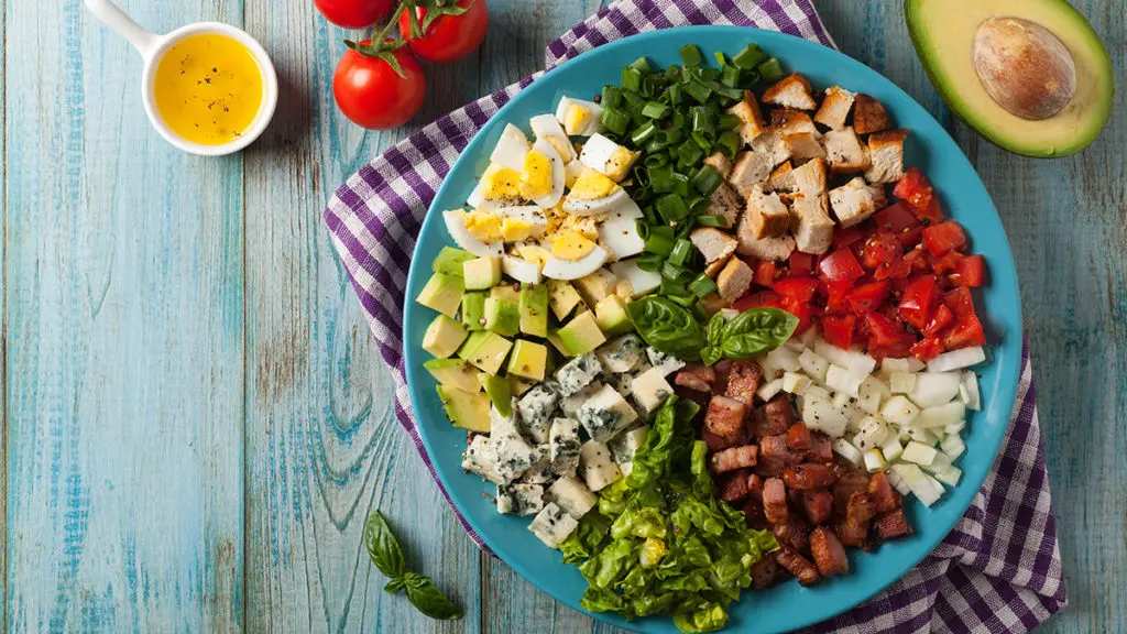 Photo of salads with a cobb salad on a plate