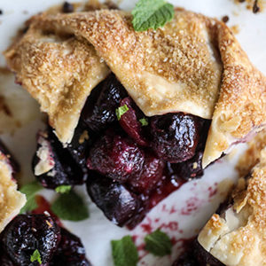 Photo of summer desserts with a closeup of a cherry galette.