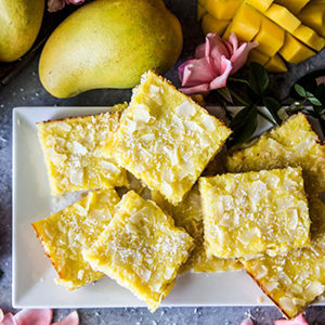 Photo of summer desserts with a plate of mango coconut cookie bars