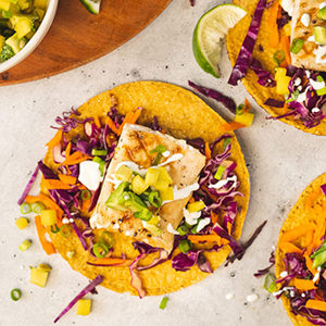 August recipes with a closeup of a grilled fish tostada