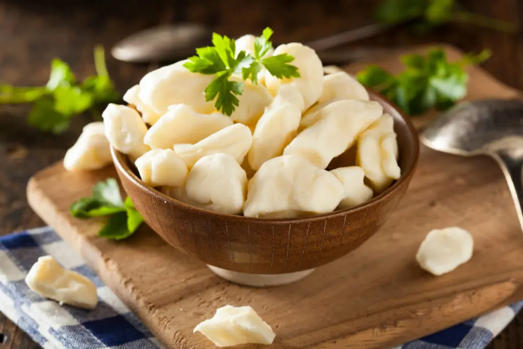 Bucket list. White dairy cheese curds in a bowl