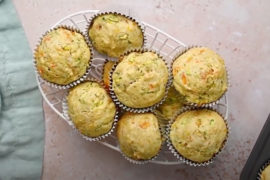 Zucchini carrot muffins in a basket.