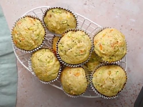 Zucchini carrot muffins in a basket.
