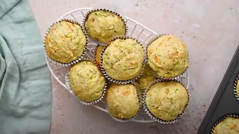 Zucchini carrot muffins in a basket.