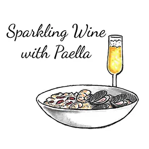 Global cuisine wine pairings with a glass of sparkling wine next to a bowl of paella.
