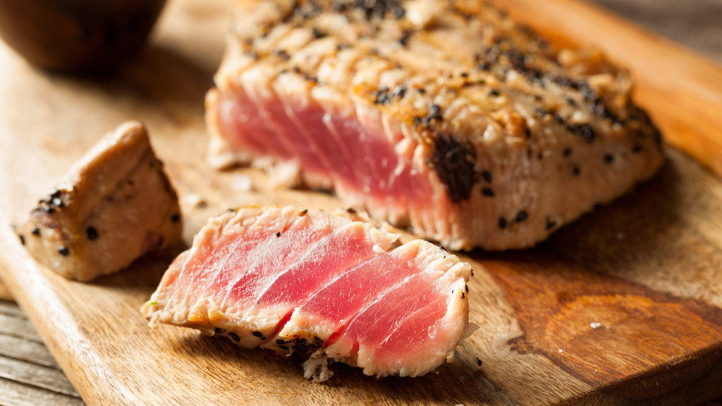Photo of how to grill with a closeup on a slice of mahi mahi tuna steak.