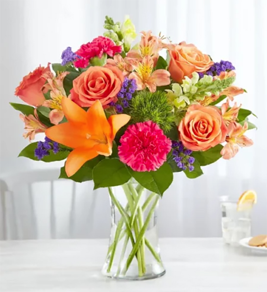 Party themes for adults with a bouquet of flowers on a table.