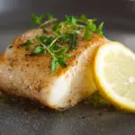 Nothing Says Romantic Dinner More Than Chilean Sea Bass With Mint, Caper, Olive Relish