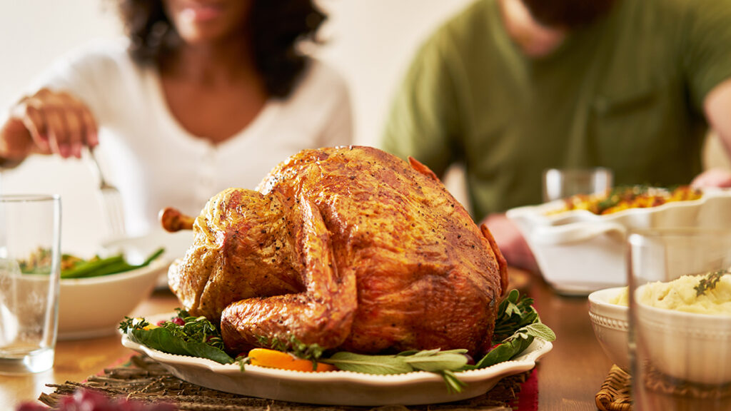When is thanksgiving with a closeup of a turkey on a table at thanksgiving.