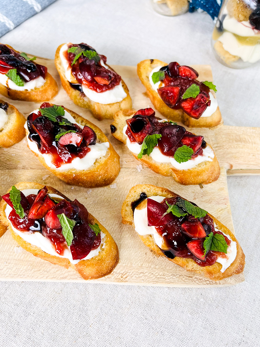Easy dinner ideas with a wooden board full of crostinis.