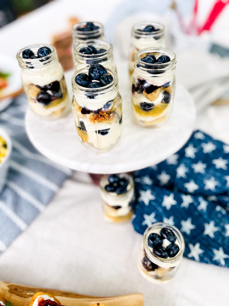 Easy dinner ideas with several jars of blueberry lemon parfaits on a table.
