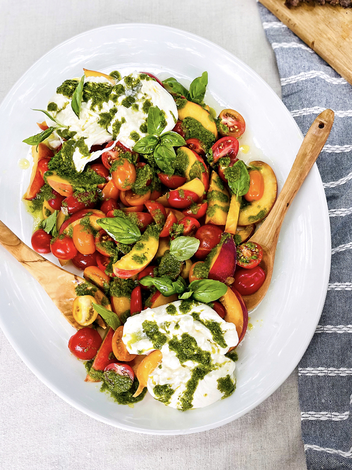 Easy dinner ideas with a tomato and burrata salad on a plate.
