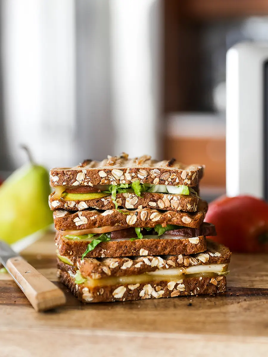 Types of pears with a pear panini stacked on top of another panini.