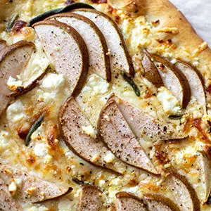 Pear recipes with a closeup of a pear covered pizza.