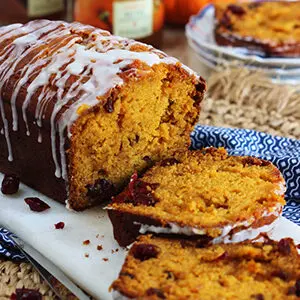 Pumpkin recipes with a loaf of pumpkin cranberry bread.