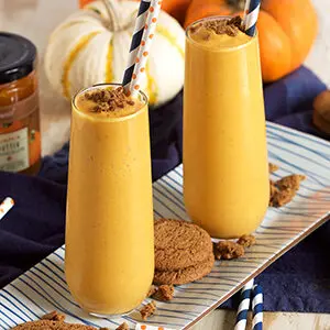 Pumpkin recipes with two pumpkin smoothies on a plate.