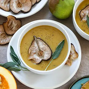 Pumpkin recipes with a bowl of pumpkin pear soup.