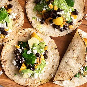 Pumpkin recipes with a plate of vegetarian tacos.