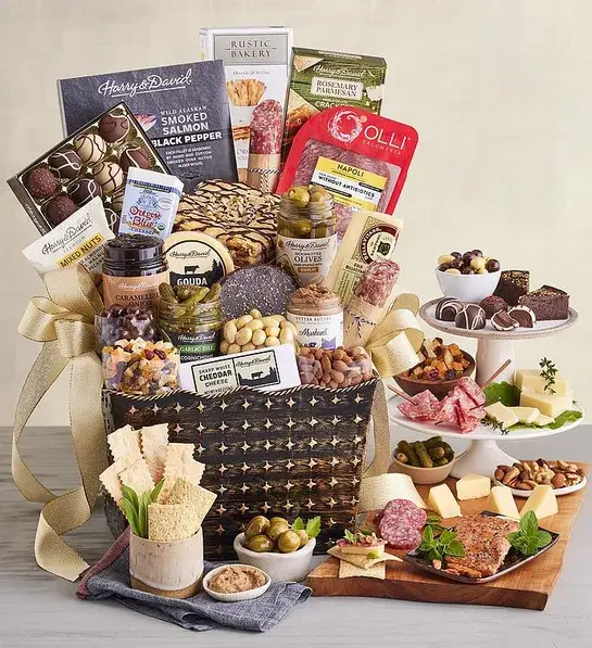 Best gifts with a basket full of sweet and savory snacks and treats surrounded by more of the same snacks.