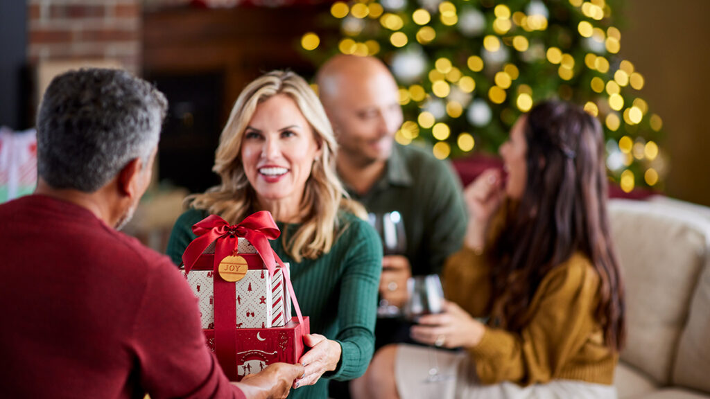 Best gifts with a woman handing a man a present