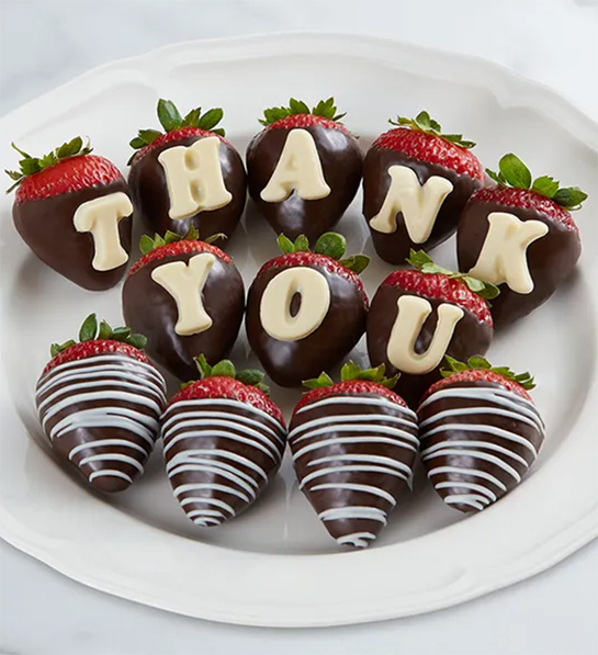 Boss's gift ideas with a plate of chocolate covered strawberries that say "thank you".