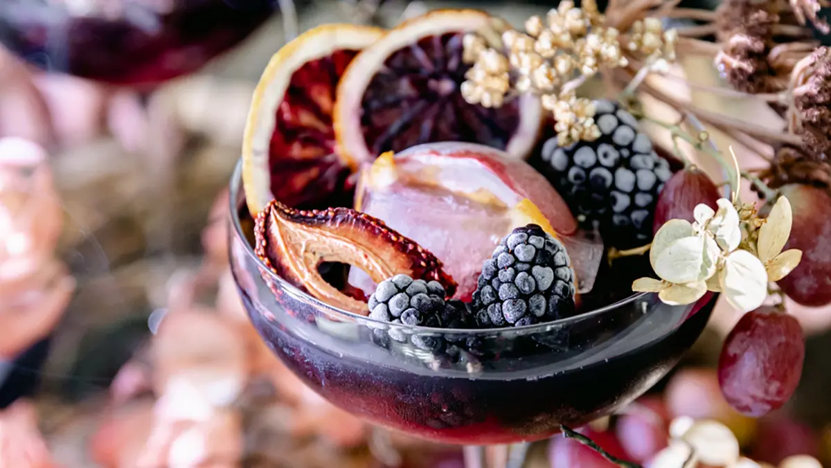 Halloween cocktail with fresh and dried fruit.