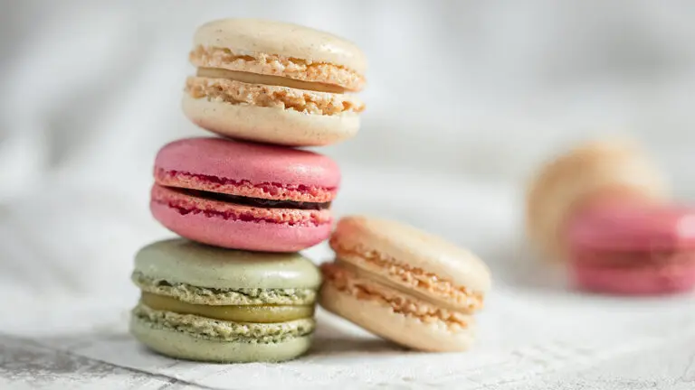 Macaroon vs macaron with a stack of macarons