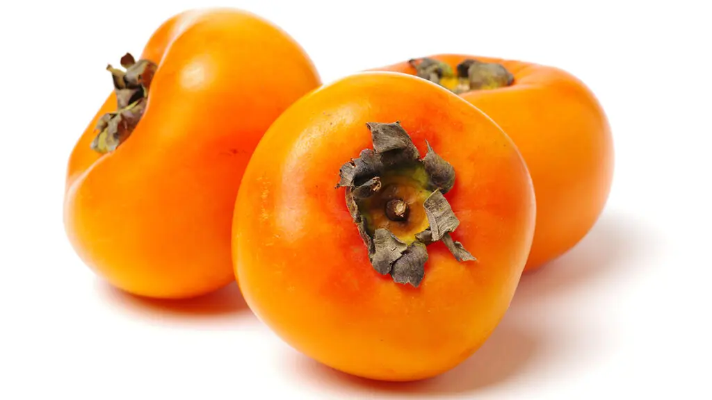 Persimmons with a white background.