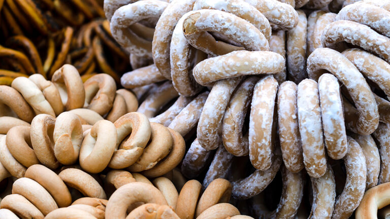 Types of bagels on display at a market.