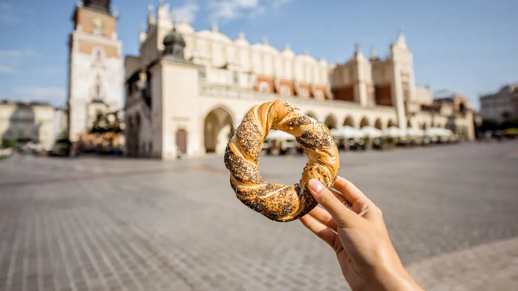 Types of bagels around the world with a Polish obwarzanek held up outside.
