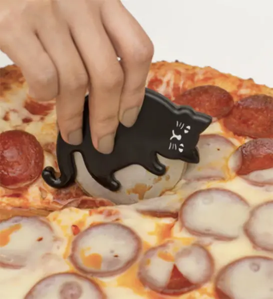 Types of pizza with a hand using a pizza cutter to slice a pizza.