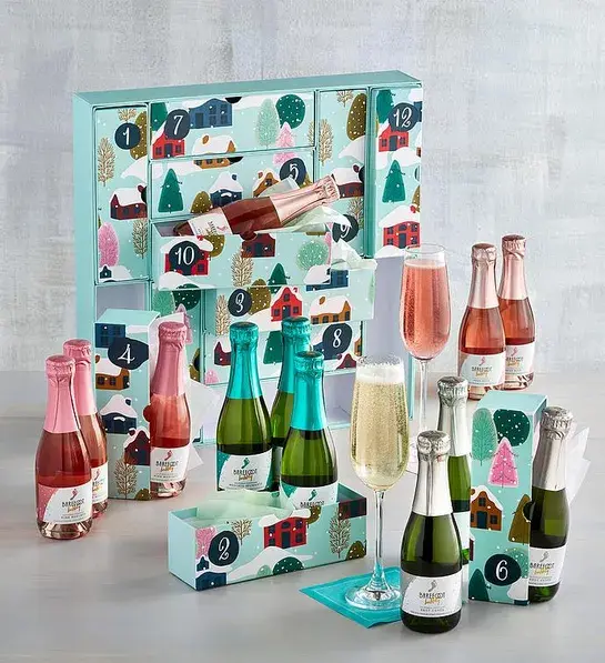 Advent calendar with small bottles of sparkling wine in front of it.