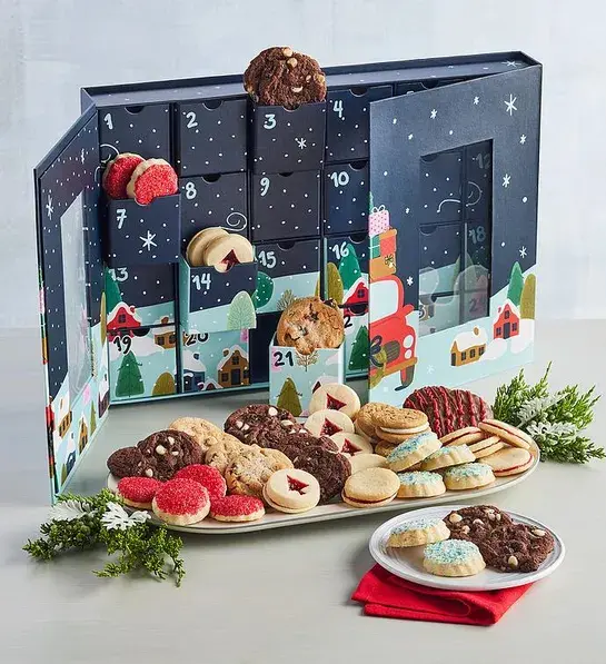 Advent calendar with different types of cookies in front of it.